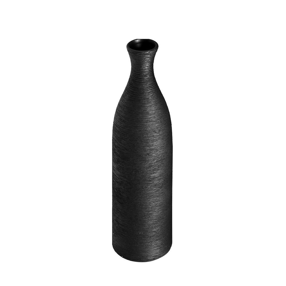Tall slim black porcelain bottle vase with a brushed texture on white