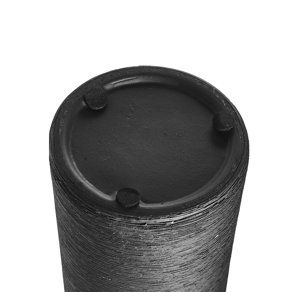 The flat base of the black vase with small pads underneath