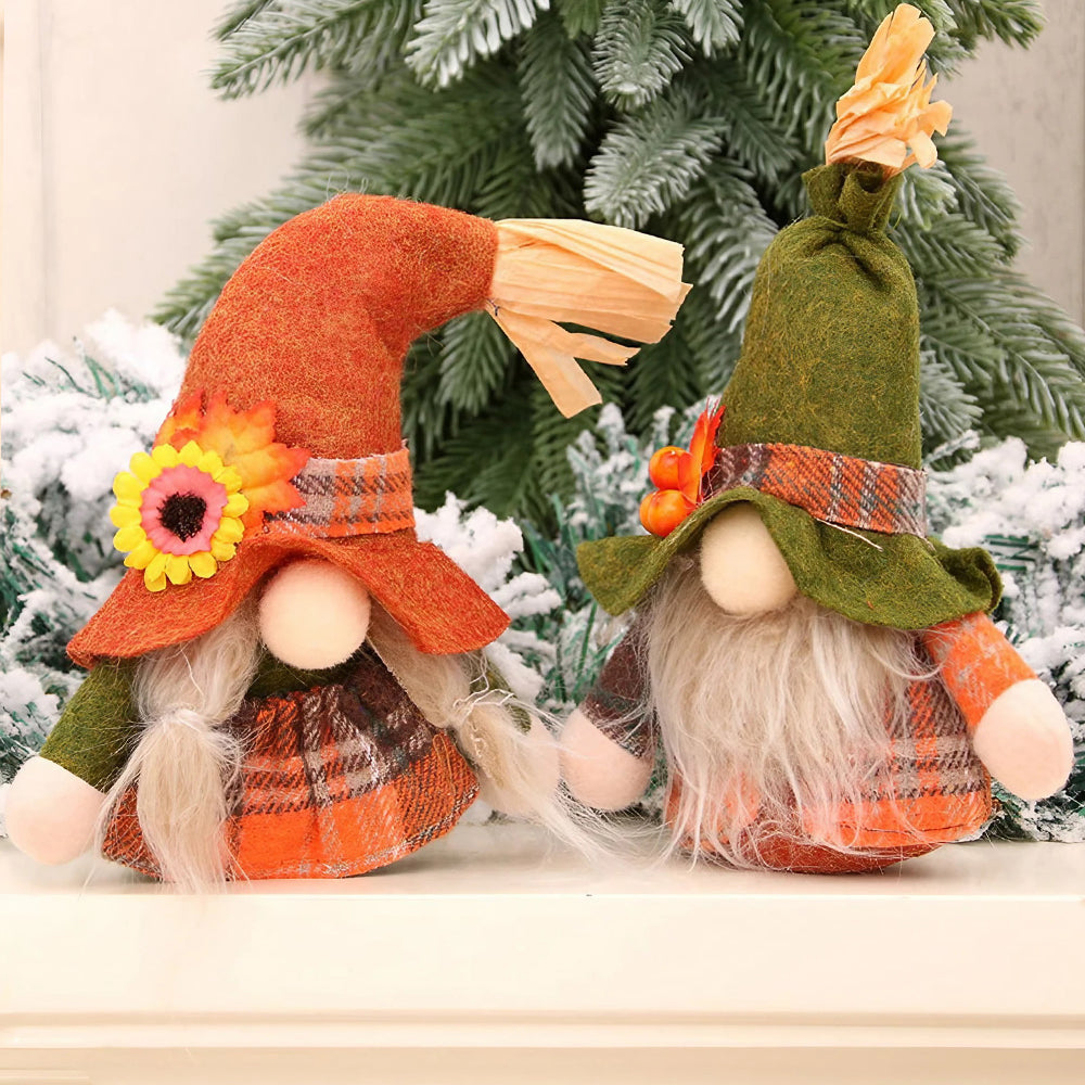 Close view of the two plaid gnomes with long pale beards in front of a snowy tree