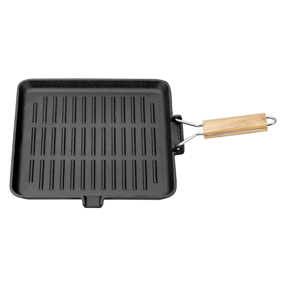 Square black cast iron grill pan with raised ribs and a folding wire and wooden handle, on white