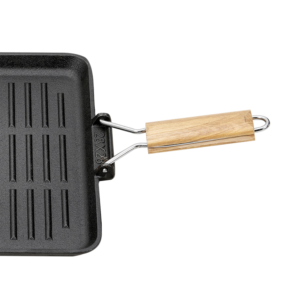 Close-up of the folding wire handle with its wooden grip on the pan side