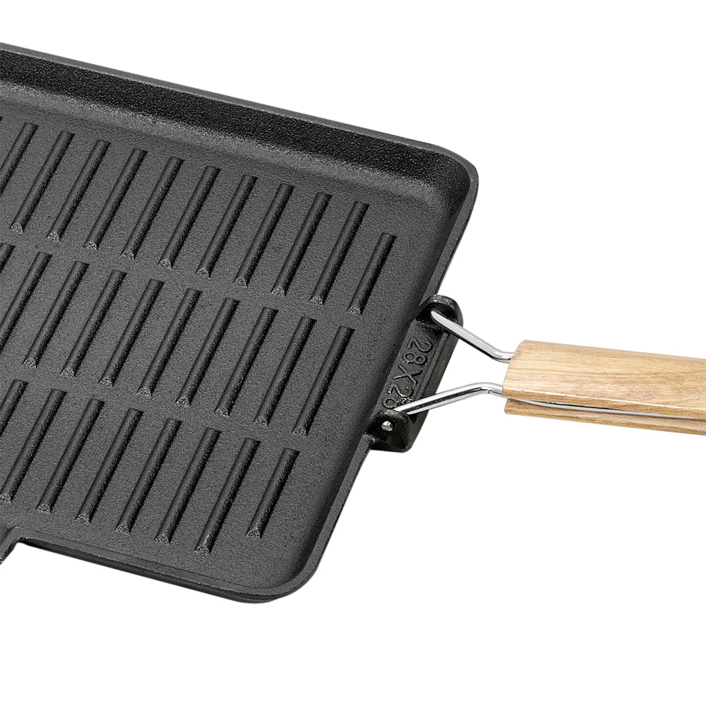 Close-up of a corner of the grill pan and the wire handle hinge