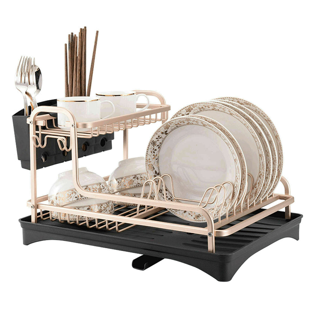 Two-tier dish rack on white holding plates, cups, chopsticks and cutlery