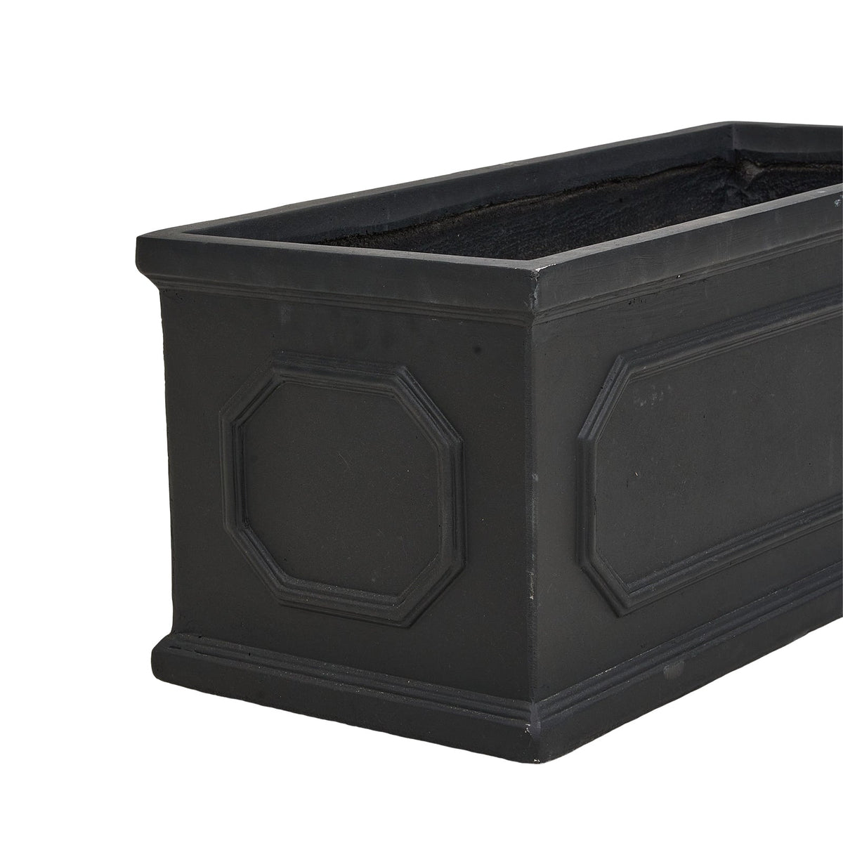 Empty black rectangular cement planter with panelled sides on white