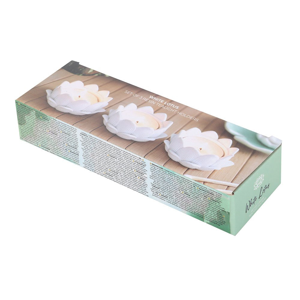 The set of three lotus tealight holders in its printed gift box