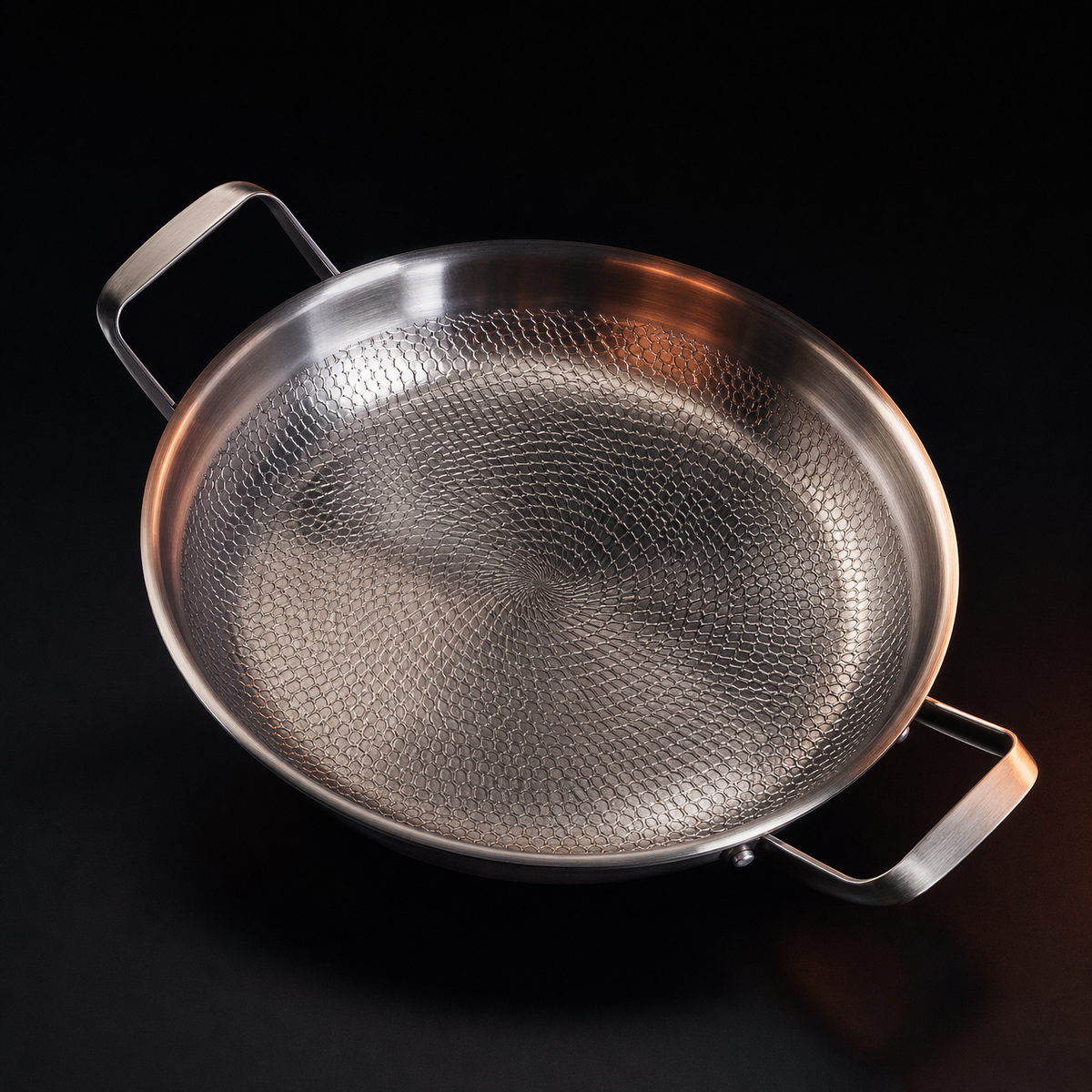 Overhead view of the same pan, showing the hammered dimples spiralling out from the centre of the base.