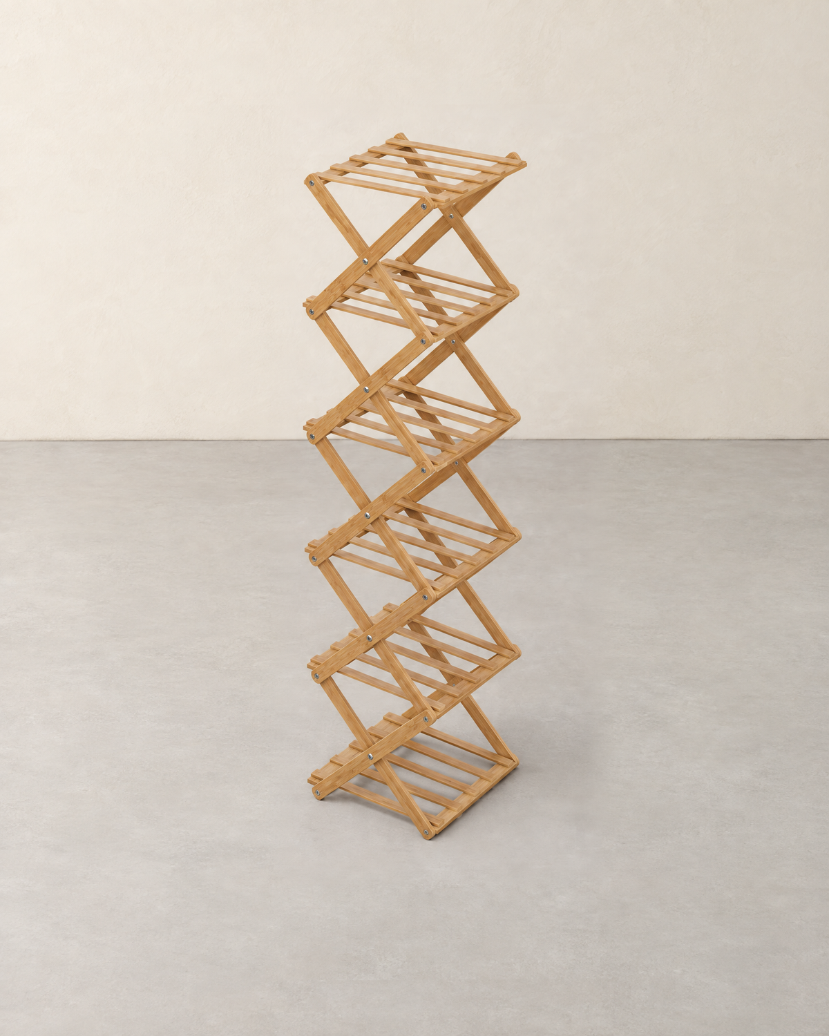Narrow six-tier folding bamboo shoe rack in light brown with X-shaped braces