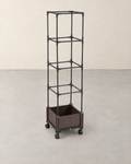 Square brown rattan-effect planter on four castors with a tall black four-tier trellis