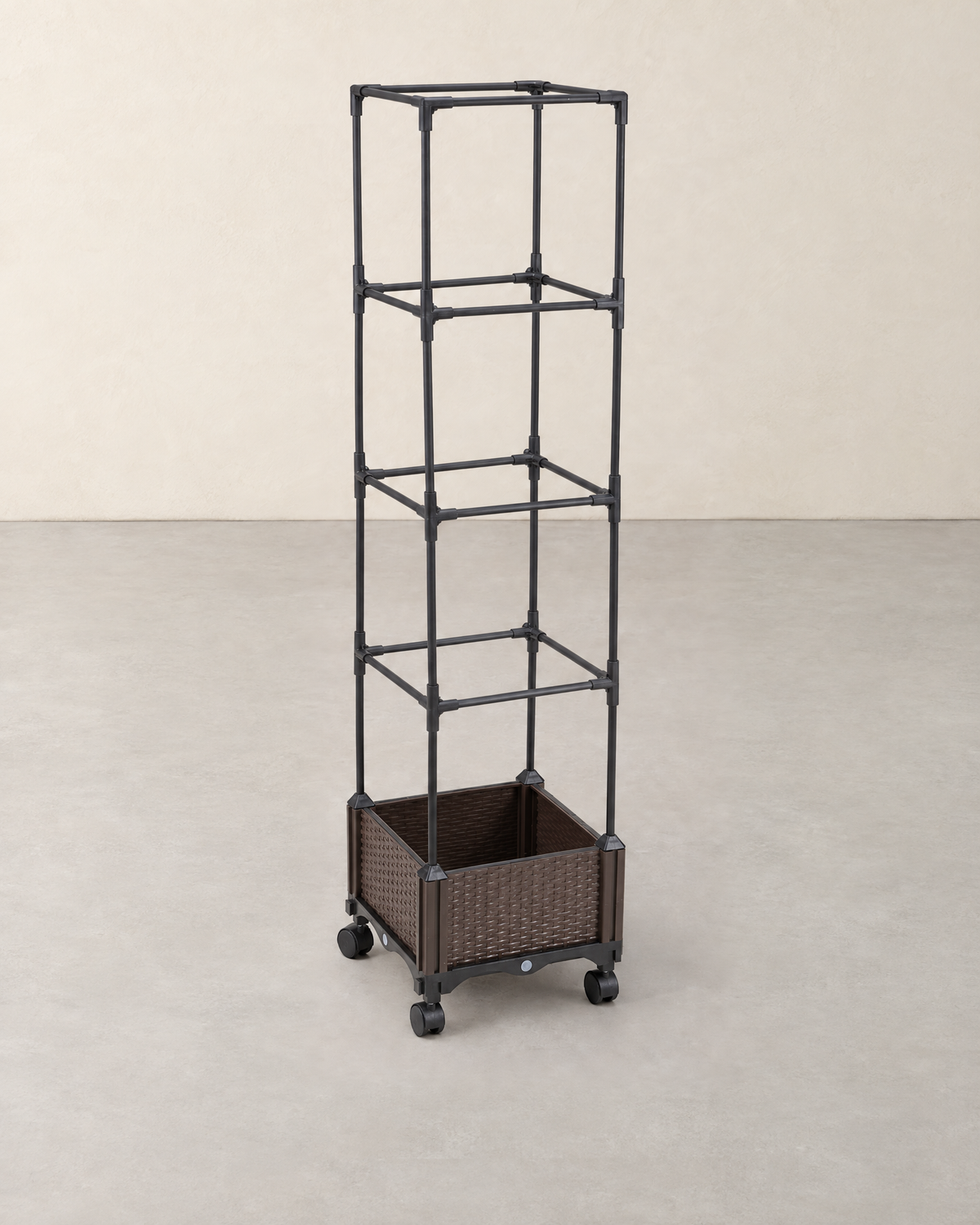 Square brown rattan-effect planter on four castors with a tall black four-tier trellis