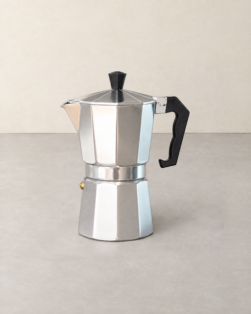 Large eight-sided aluminium stovetop espresso maker with a black handle and knob
