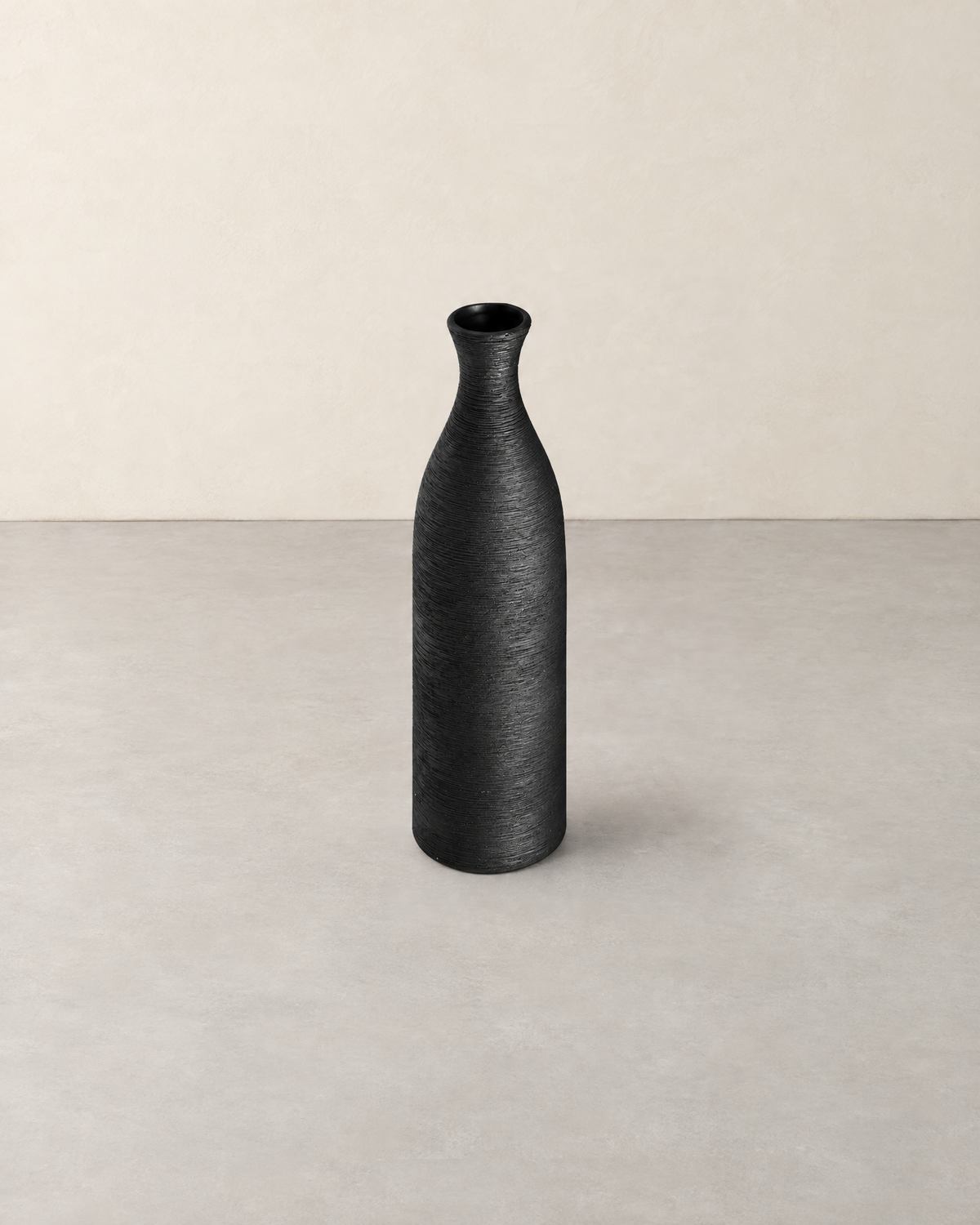 Tall slim black porcelain bottle vase with a brushed texture