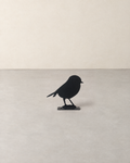 Black steel robin silhouette fence topper standing on its base plate