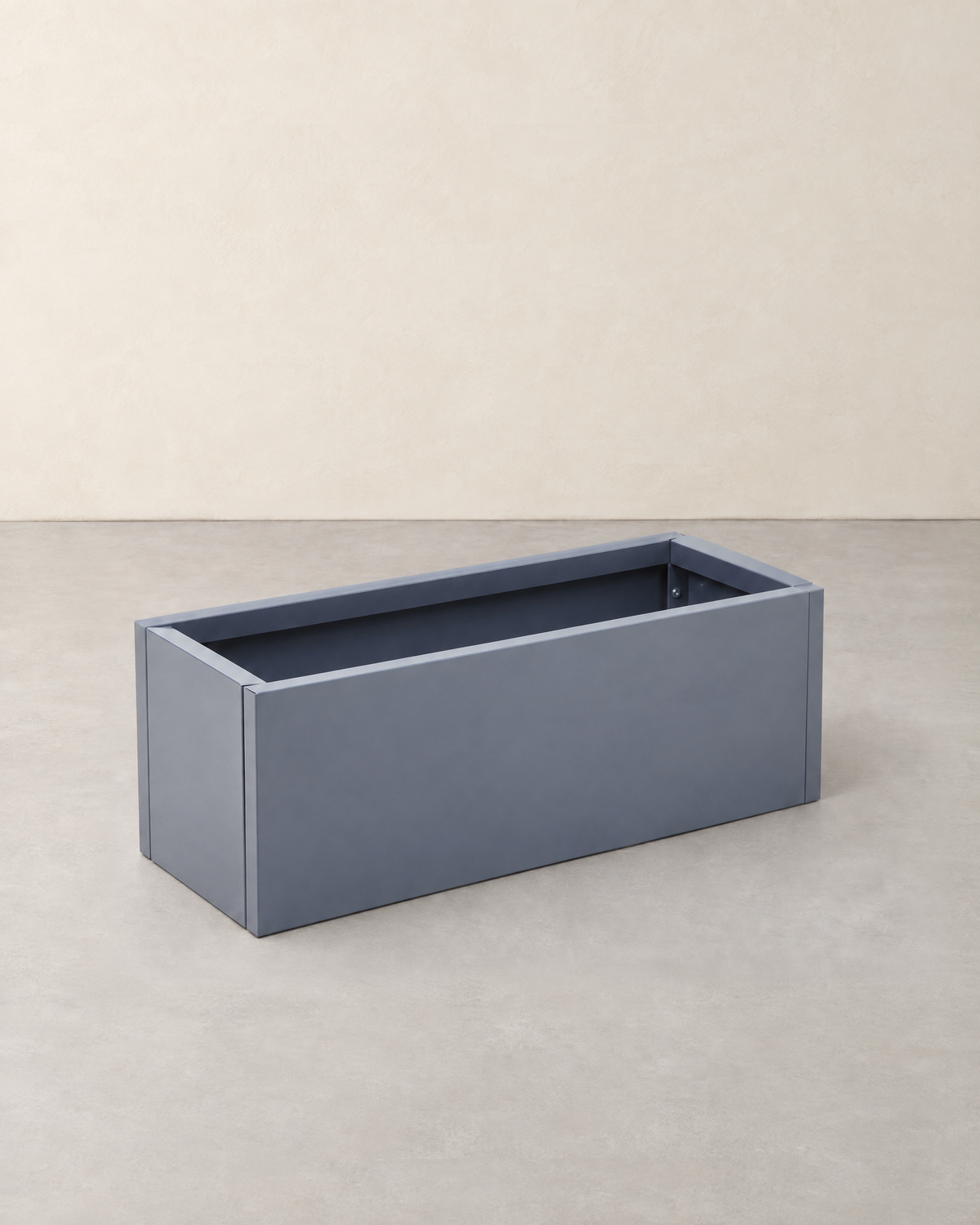 Empty long rectangular dark grey steel planter