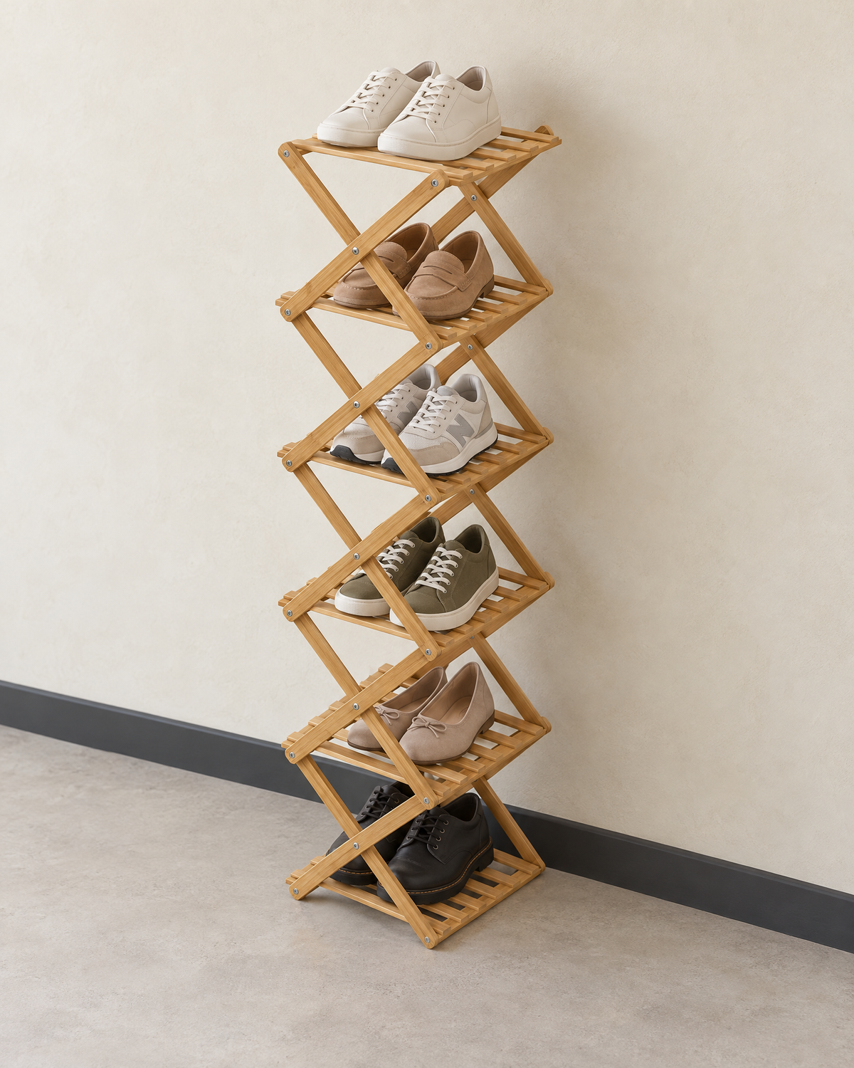 The light bamboo six-tier shoe rack in a hallway with a pair of shoes on each tier